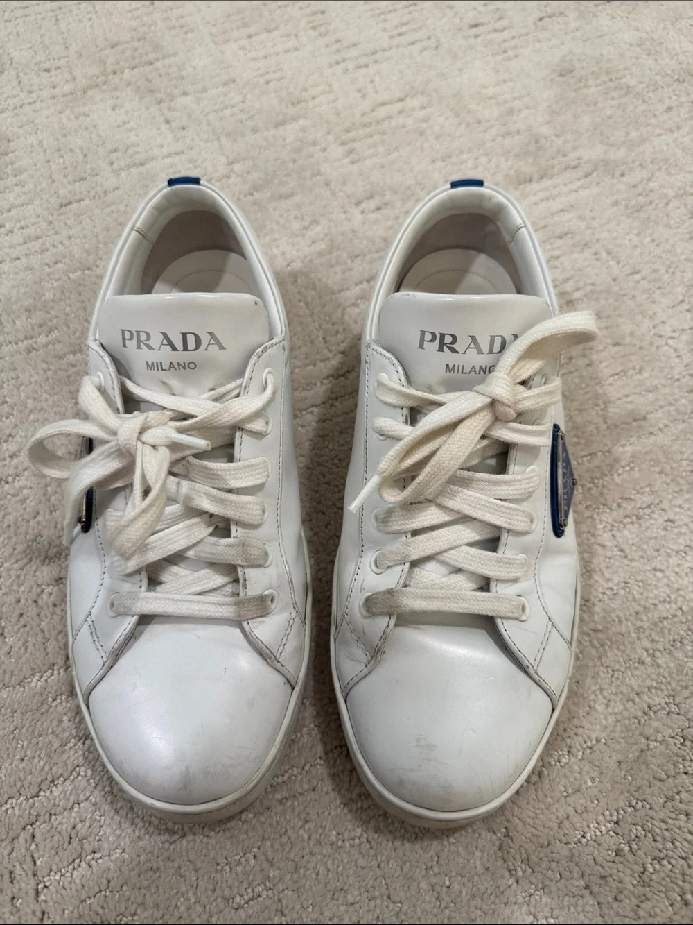Prada White Leather Sneakers with Blue Logo Accent